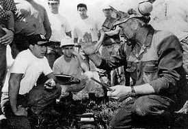 Søren Eriksson explains filing technique to a group of Game of Logging students