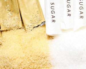 Two brown sugar packs and two white sugar packs