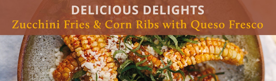Zucchini fries and corn ribs with queso fresco on a plate, from Delicious Delights.