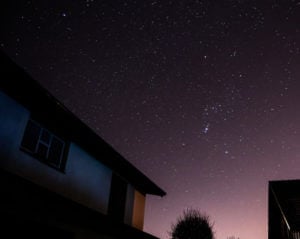 house with star filled sky