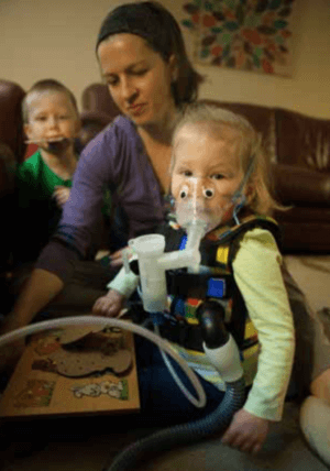 June performs airway clearance twice per day, everyday, more often when she has a cough. These treatments involve inhaled mucolytics and a vest that helps to keep her lungs clear. This is just one form of airway clearance.