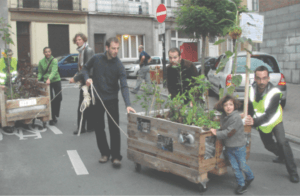 people moving a planter