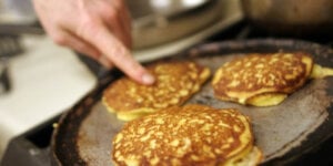 Three pancakes on a griddle