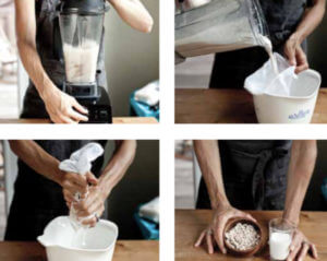 A blender filled with nuts and water to make nut milk