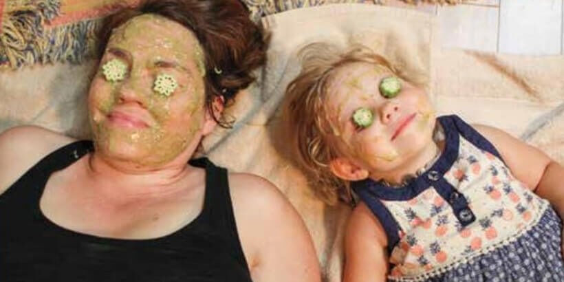 woman and child wearing an okra facemask