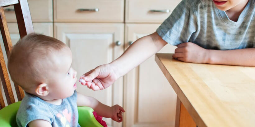 parent feeding baby