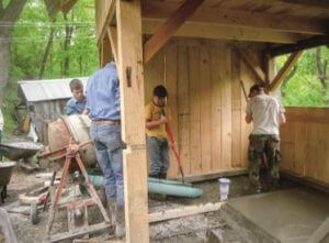 group of men building a structure