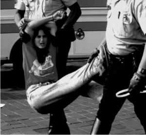 liasa fithian being carried by police