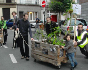 people moving a garden box