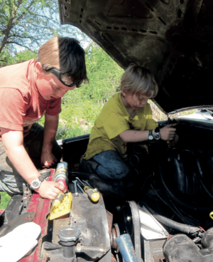 kids working on a car