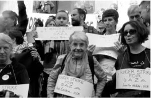 woman with hunger strike for gaza sign