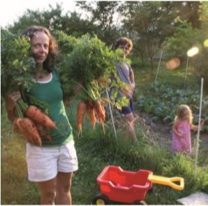 woman holding carrots