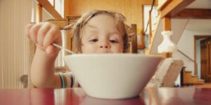 kid eating out of a bowl